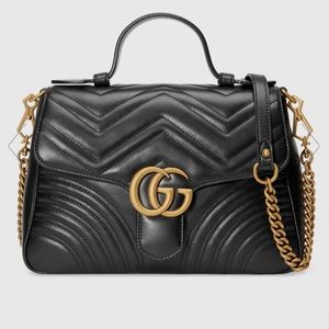 Small top handle black and gold Gucci bag